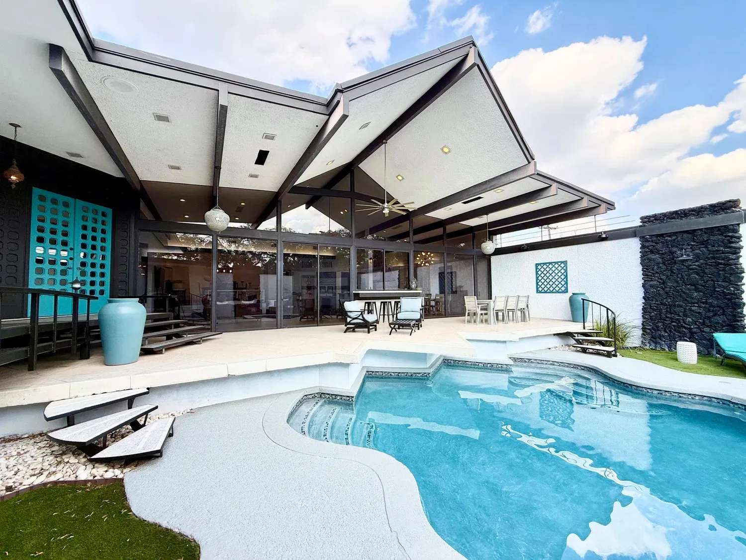 Villa Rica, a furnished home in Meyerland, Houston, TX, with a private pool and covered outdoor living